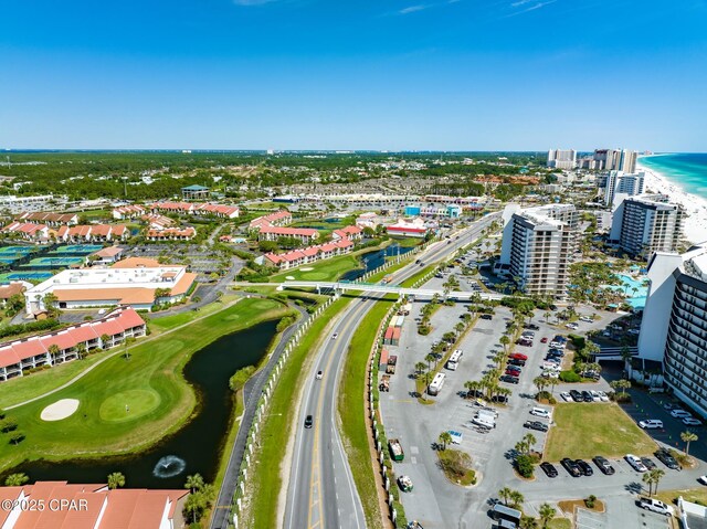 bird's eye view featuring a water view and a beach view