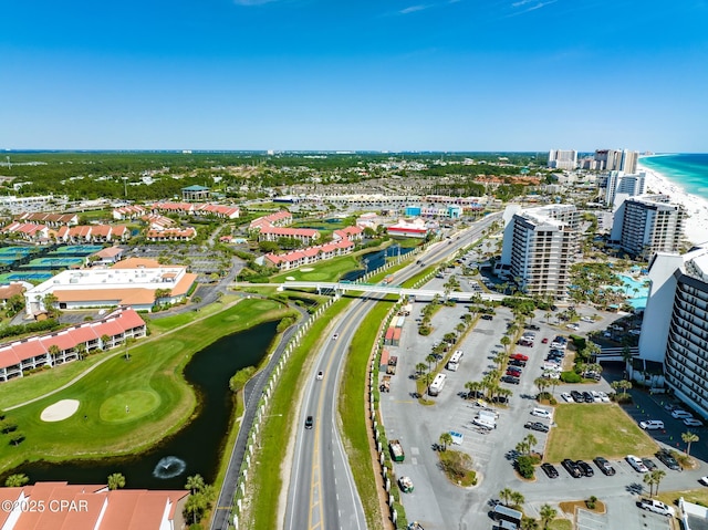 birds eye view of property with a view of city and a water view