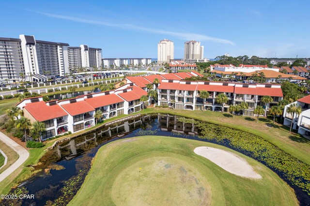 birds eye view of property with a view of city and a water view