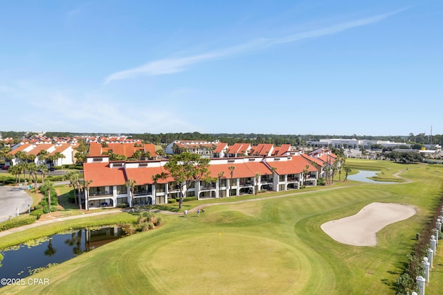 aerial view featuring a water view and view of golf course