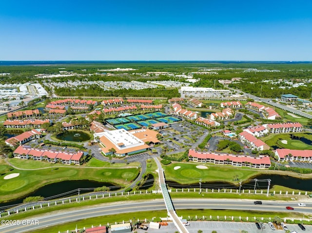 aerial view featuring a water view and view of golf course