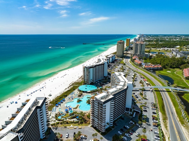 aerial view featuring a water view, a view of city, and a view of the beach