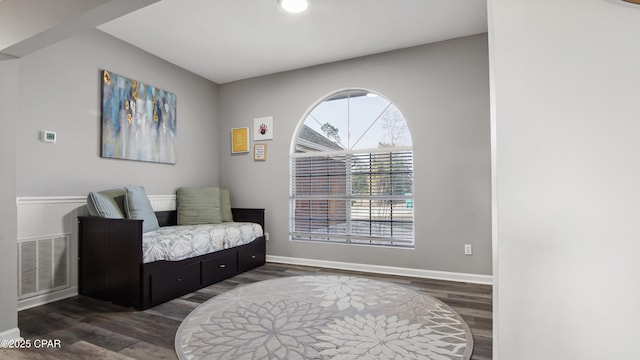 sitting room featuring visible vents, baseboards, and wood finished floors