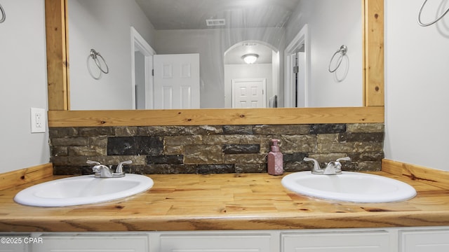 bathroom featuring visible vents and vanity