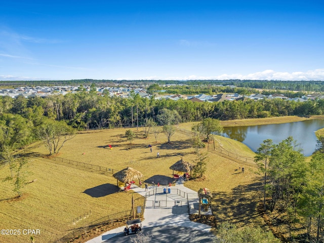 birds eye view of property featuring a water view and a rural view