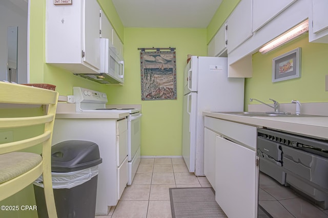 kitchen with white cabinetry, sink, light tile patterned floors, and white appliances