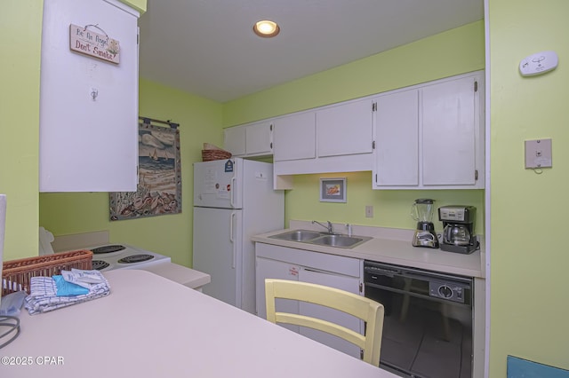 kitchen featuring dishwasher, white fridge, sink, and white cabinets