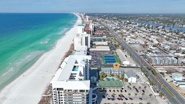 birds eye view of property with a water view and a view of the beach