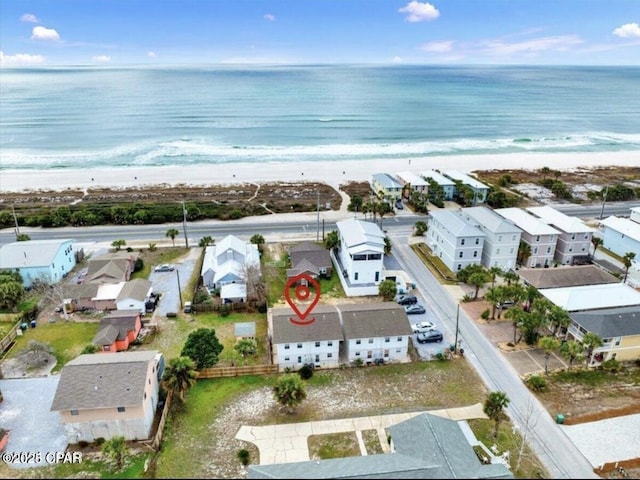 bird's eye view featuring a beach view, a residential view, and a water view