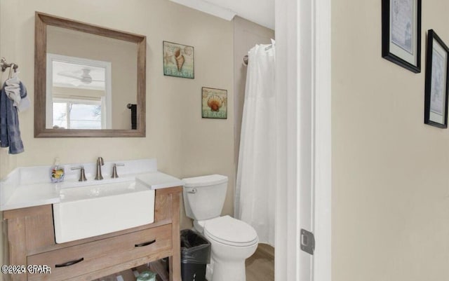 full bath with a shower with shower curtain, toilet, and vanity