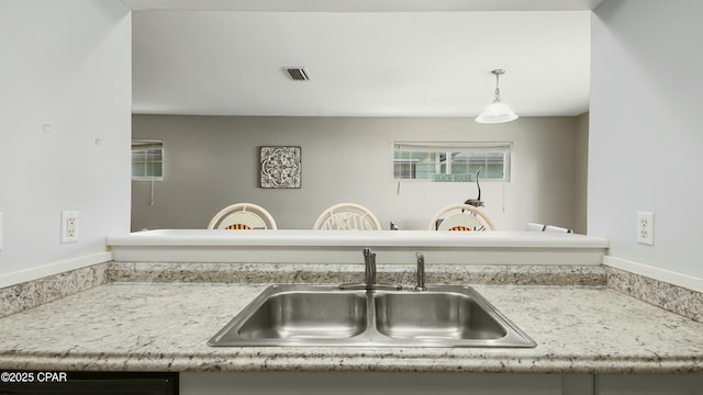 kitchen with pendant lighting and sink