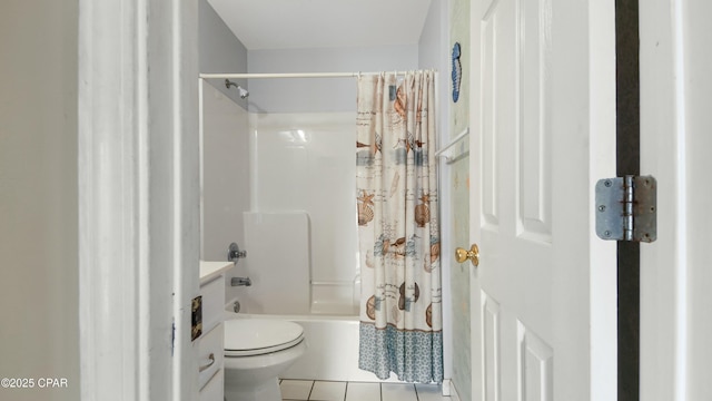 bathroom with tile patterned flooring, toilet, and shower / bath combo with shower curtain