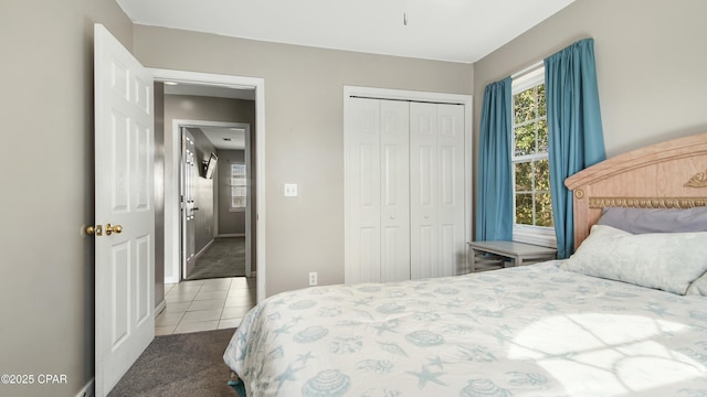 tiled bedroom featuring a closet