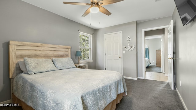 carpeted bedroom with ceiling fan