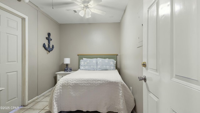 bedroom featuring light tile patterned flooring and ceiling fan