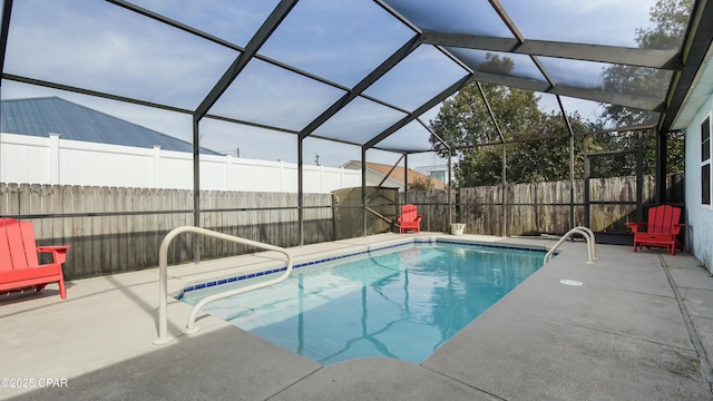 view of pool with a patio and a lanai