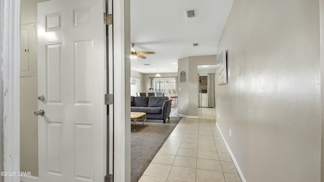 corridor with light tile patterned floors