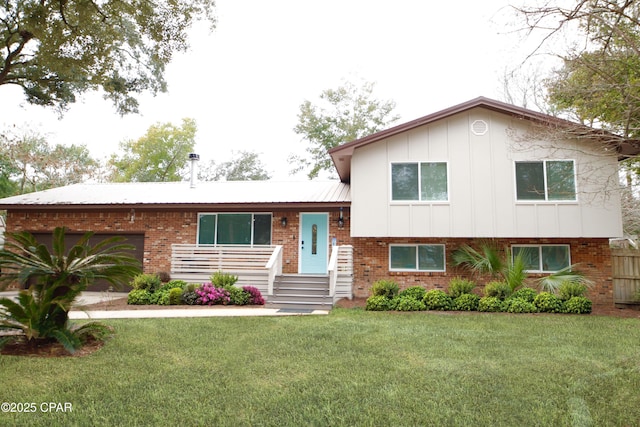 split level home featuring a garage and a front lawn