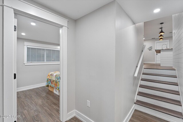 stairway featuring hardwood / wood-style floors