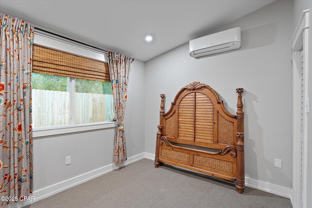 sitting room featuring an AC wall unit and carpet