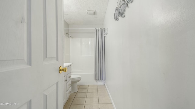 full bathroom with tile patterned floors, toilet, a textured ceiling, vanity, and shower / bathtub combination with curtain