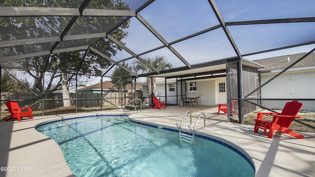 view of swimming pool with a patio and glass enclosure