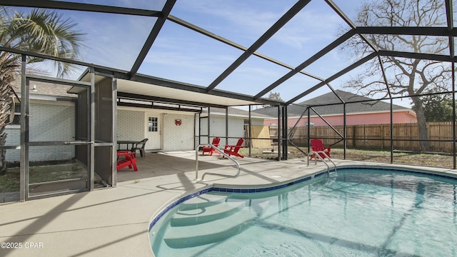 view of pool featuring a patio and glass enclosure