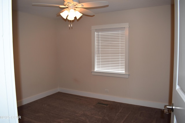 spare room with ceiling fan, baseboards, and visible vents