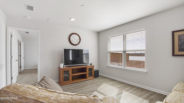 living room with light hardwood / wood-style floors