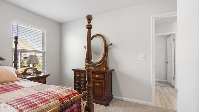 bedroom featuring light colored carpet