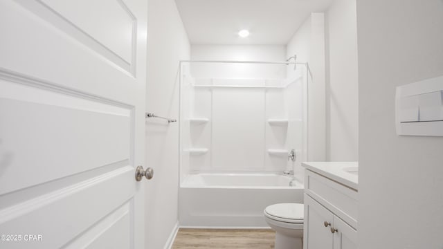 full bathroom with vanity, toilet, hardwood / wood-style floors, and shower / bathing tub combination