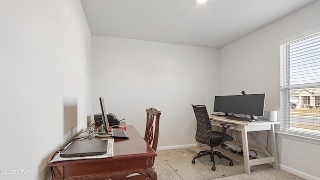 office area with light colored carpet