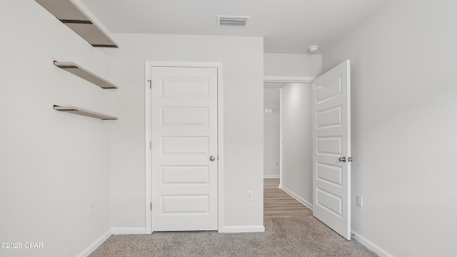 interior space featuring light colored carpet