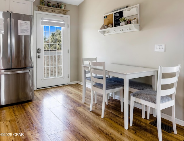 dining room featuring light hardwood / wood-style floors