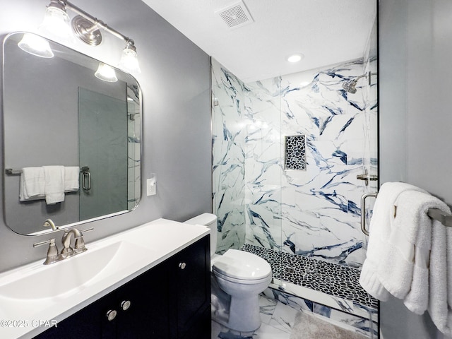 bathroom featuring walk in shower, vanity, and toilet