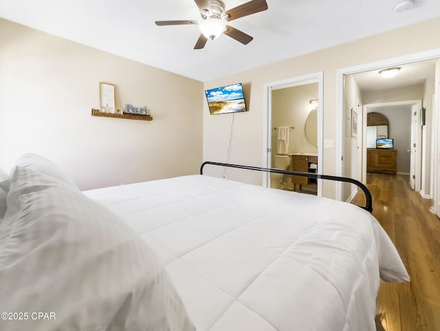 bedroom featuring hardwood / wood-style flooring and ceiling fan