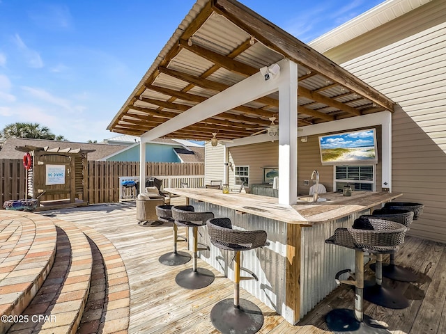 wooden terrace with a bar