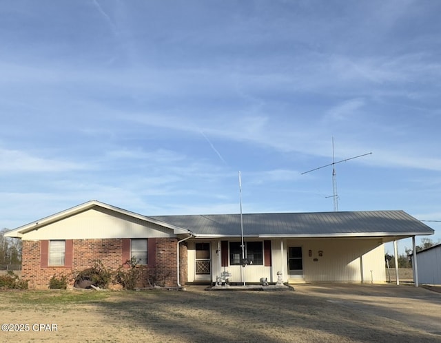 view of front of house featuring a carport and covered porch