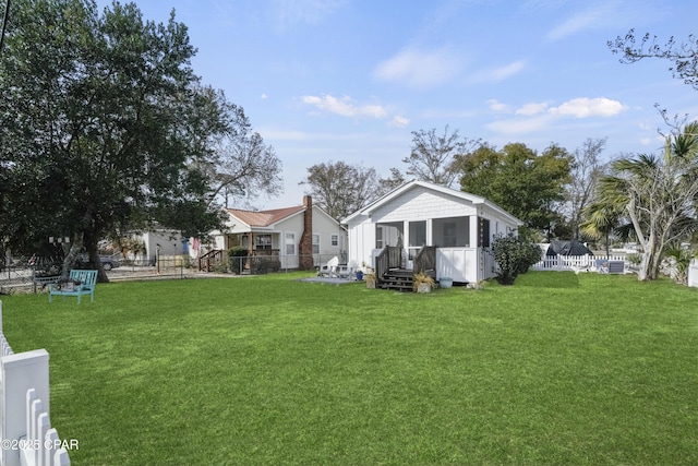 view of yard featuring a sunroom