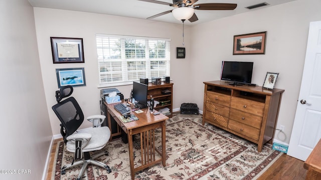 office space featuring wood-type flooring and ceiling fan