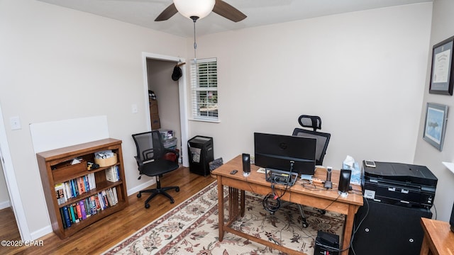 home office featuring hardwood / wood-style floors and ceiling fan