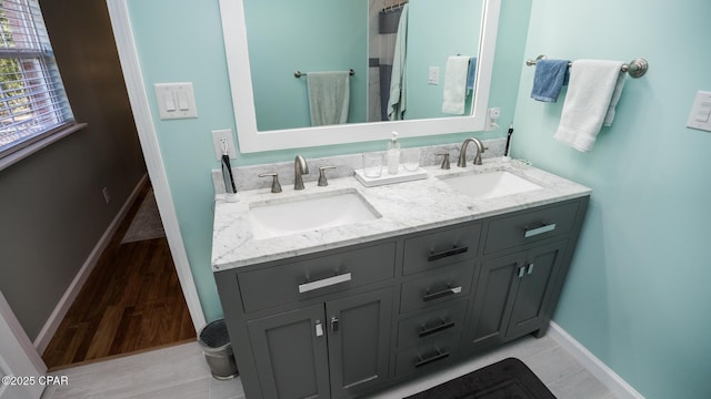 bathroom featuring hardwood / wood-style flooring and vanity