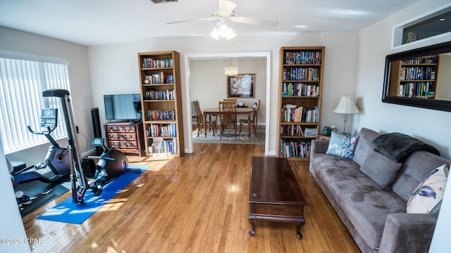 living room with hardwood / wood-style flooring and ceiling fan