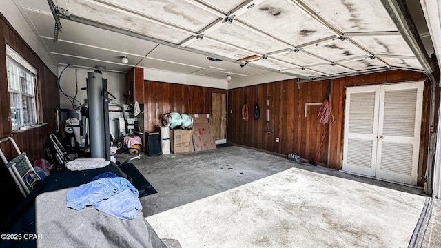 garage featuring wooden walls