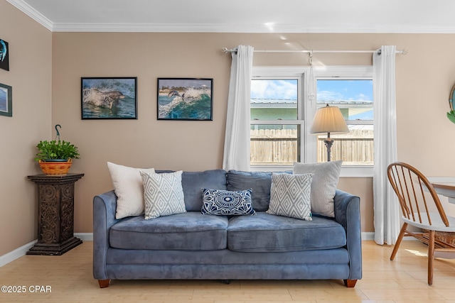 sitting room featuring ornamental molding and light hardwood / wood-style floors