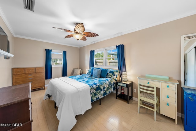 bedroom with ornamental molding, light hardwood / wood-style floors, and ceiling fan