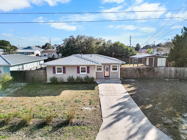 21823 Marlin Ave, Panama City Beach, FL 32413 - ranch-style house with metal roof, driveway, and concrete block siding
