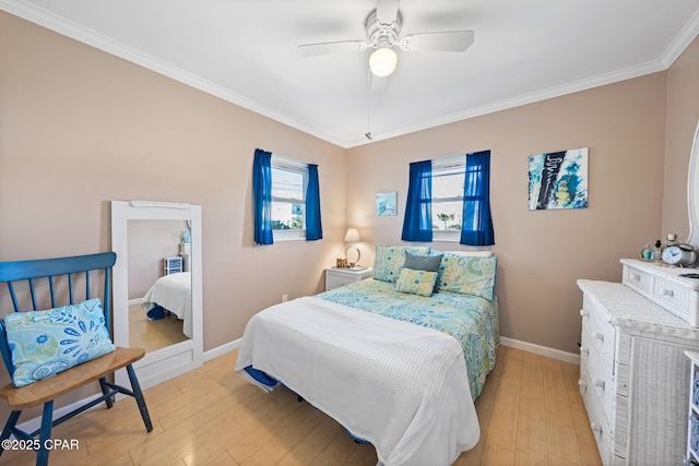 bedroom with crown molding, ceiling fan, and light hardwood / wood-style flooring