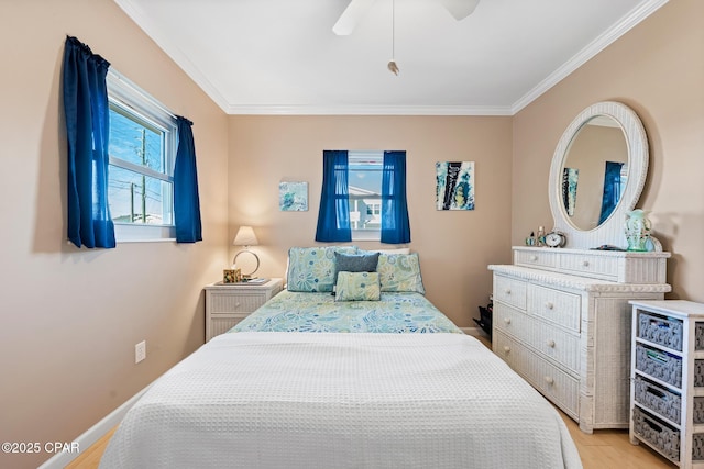 bedroom featuring crown molding, ceiling fan, and light wood-type flooring