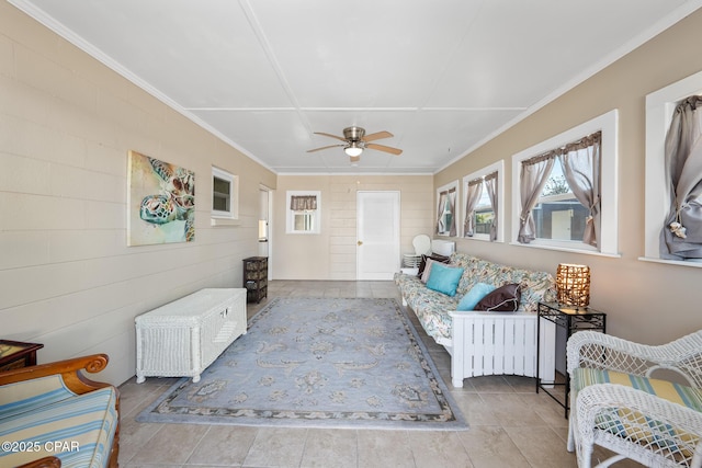 living room with ceiling fan and ornamental molding